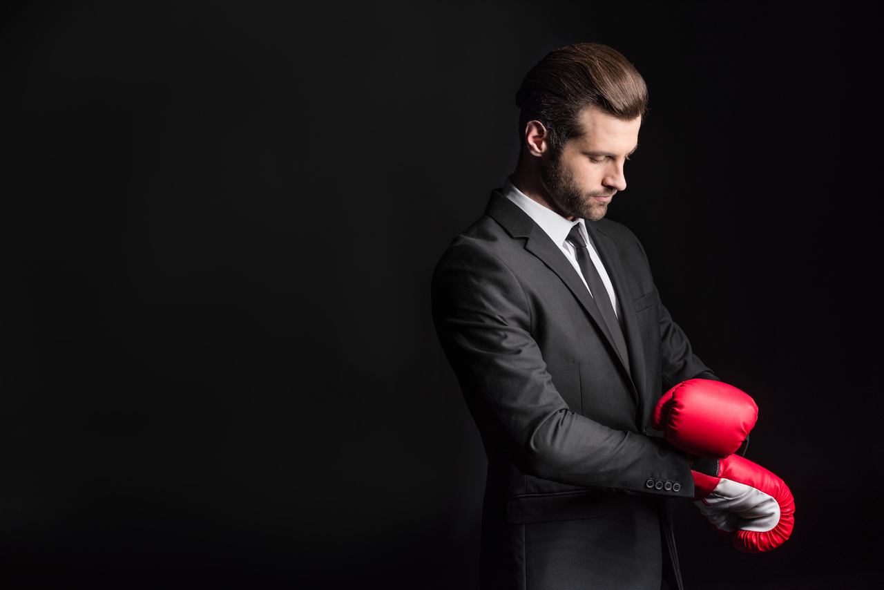 Pozycjonowanie 1 young businessman adjusting red boxing gloves iso 2024 11 18 01 43 57 utc Easy Resize.com